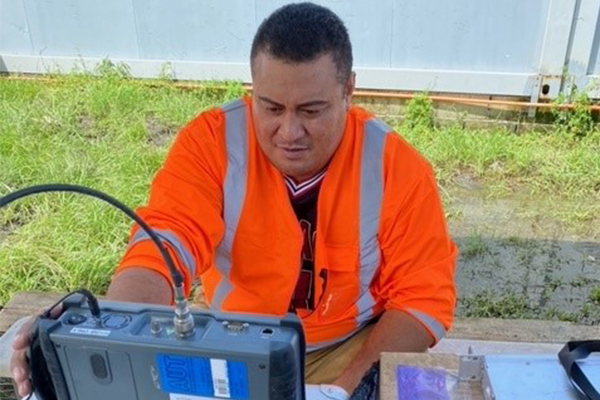 AUT graduate Stan Ahio hard at work in Tonga increasing internet access.
