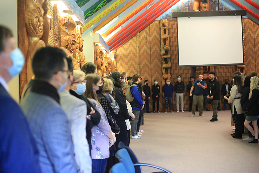 International students and staff inside the wharenui.
