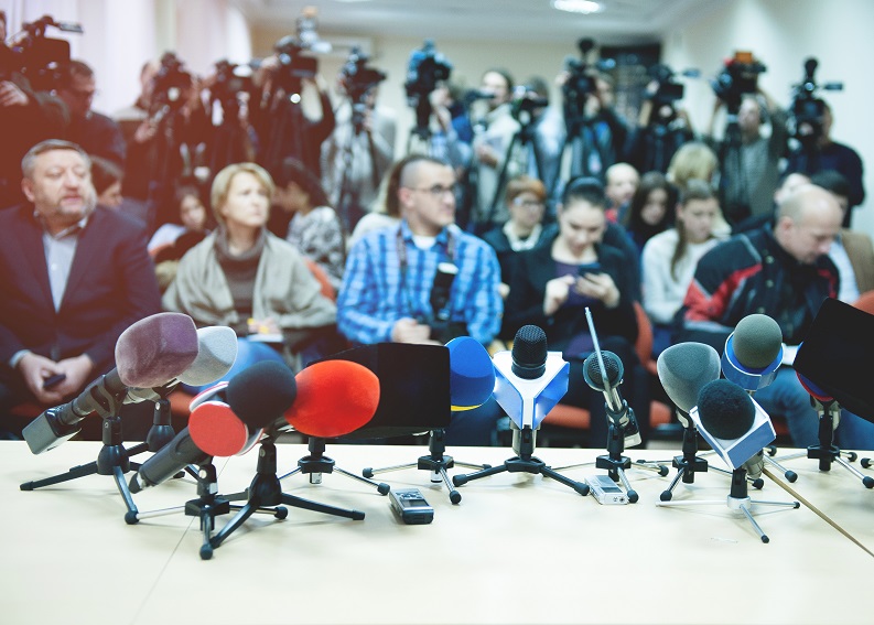 Journalists with microphones