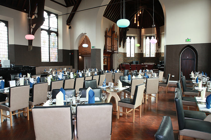 The Clink.jpg Chairs and tables laid out for fine dining in a The Clink restaurant.