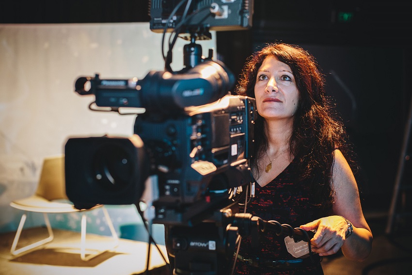 Associate Professor of Screen Production and Cultural Studies Arezou Zalipour with a camera